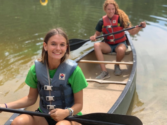 Two campers in canoe on lake